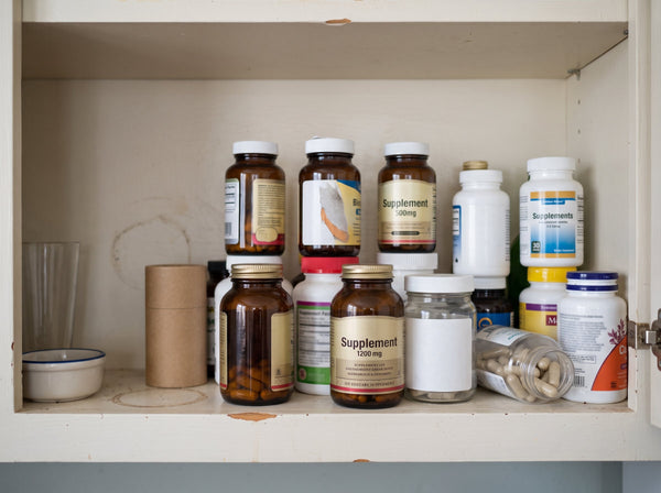A cabinet full of supplement bottles