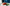 Tomatoes, olive oil, and basil on a table