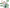 An older couple with raised fists stands against a black background with a white circular backdrop. Green circular callouts with text read 'Healthy Aging,' 'Strong Bones and Joints,' 'Mitochondrial Energy,' 'Cardiovascular Support,' and 'Cellular Defense.