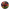 A circular overhead arrangement of colorful fruits, vegetables, nuts, and spices on a dark rustic wooden surface, surrounded by a black border. Visible items include apples, raspberries, purple cabbage, spinach, beets, walnuts, peanuts, ginger, turmeric, and potatoes.